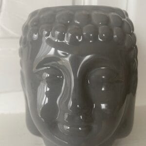 Brûleur pour fondant en forme de tête de Bouddha.