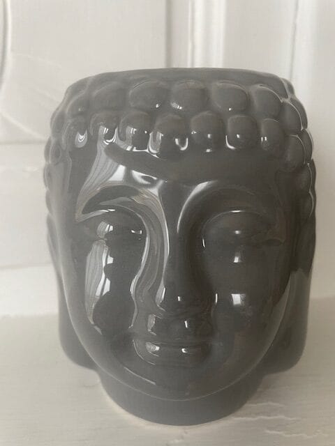 Brûleur pour fondant en forme de tête de Bouddha.
